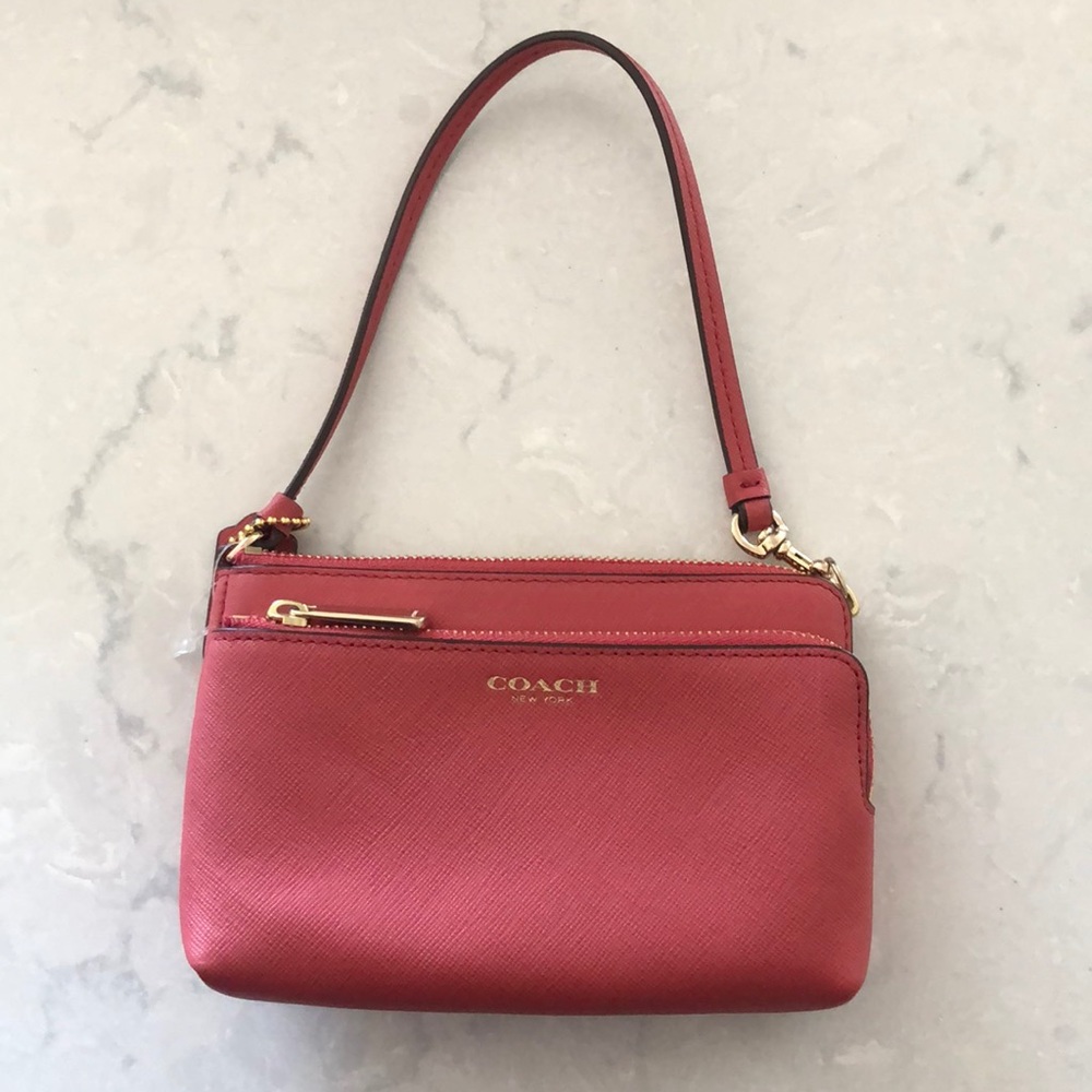 Coach rose color wristlet